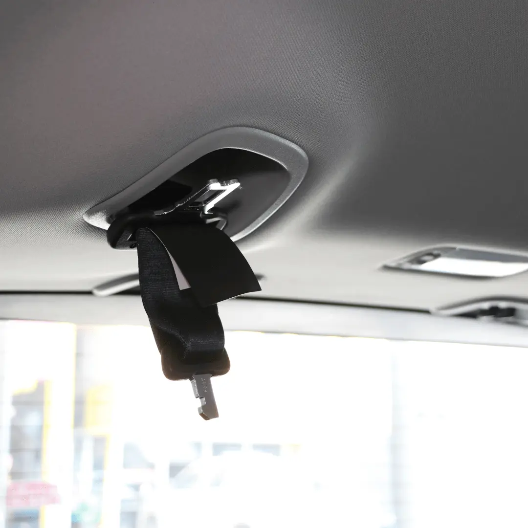 A close-up image of a top tether anchor in a vehicle, used for securing a forward-facing car seat.