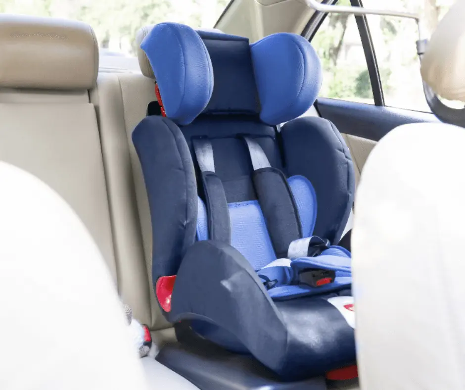 A properly installed and positioned combination car seat in the backseat of a car.