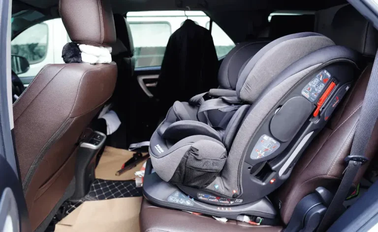 All-in-one car seat installed in a vehicle, shown in forward-facing position.
