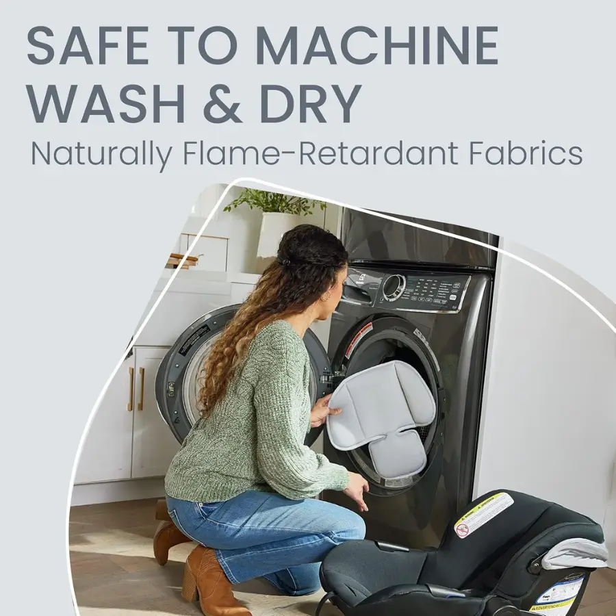 Woman placing Britax Willow S car seat insert into a washing machine.