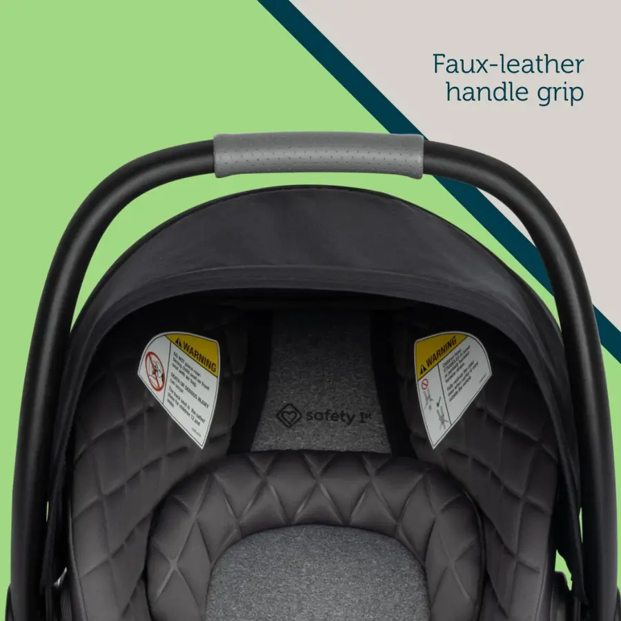 Safety 1st onBoard Insta-LATCH DLX infant car seat's handle with a faux-leather grip.