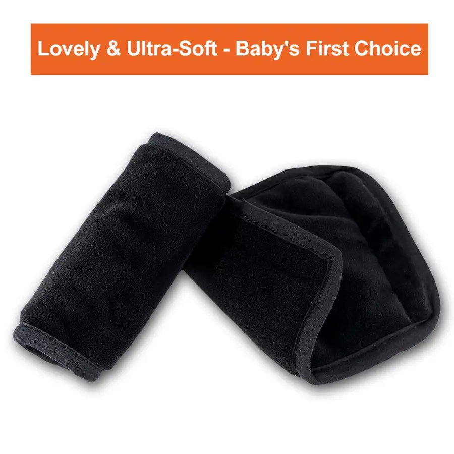 Black car seat strap shoulder pads for baby comfort.