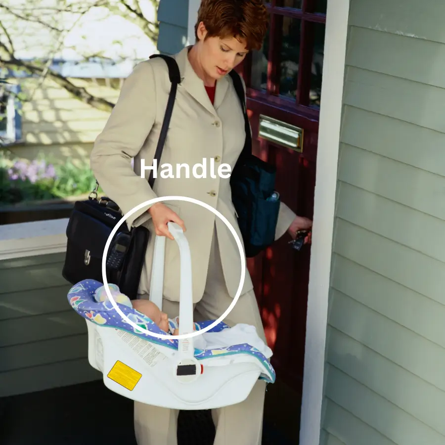 Parent carrying infant car seat by handle, showing easy carrying and portability.